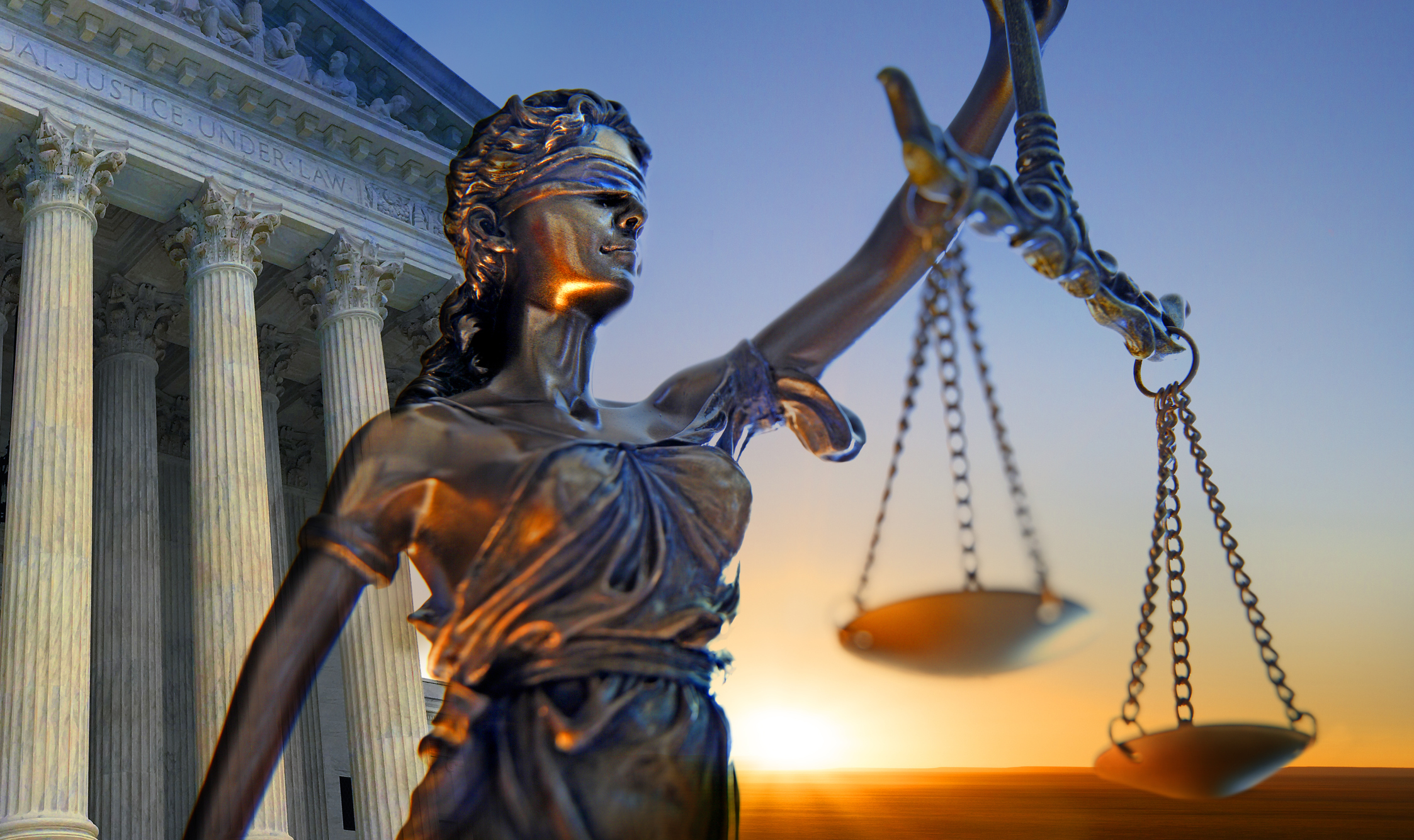 A statue of the blindfolded lady justice in front of the United States Supreme Court building as the sun rises in the distance symbolizing the dawning of a new era.